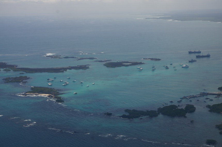 140301 8 Flying out over Puerto Villamil Andante on anchor