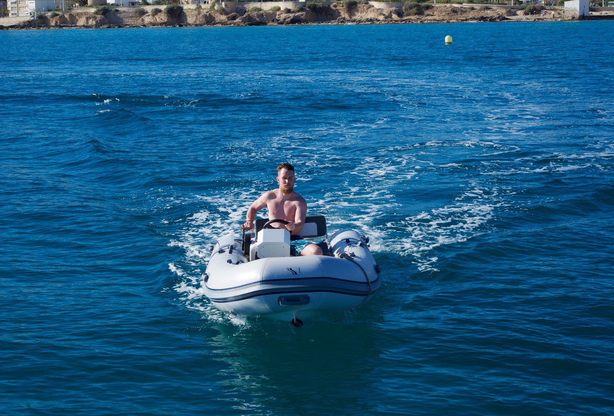 170403 On anchor Penyal d'lFac Chris checking out the dinghy